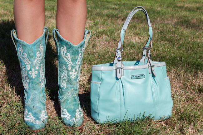 Corral turquoise cowboy boots with snip toes and a Coach bag