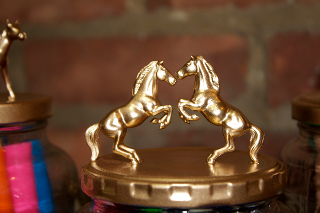 Rearing gold horses top this fun jar
