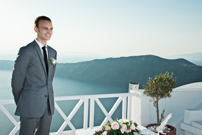 The handsome groom waiting for his bride in Santorini, Greece
