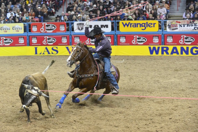 Dugan Kelly at the NFR riding in Western Dove Tack