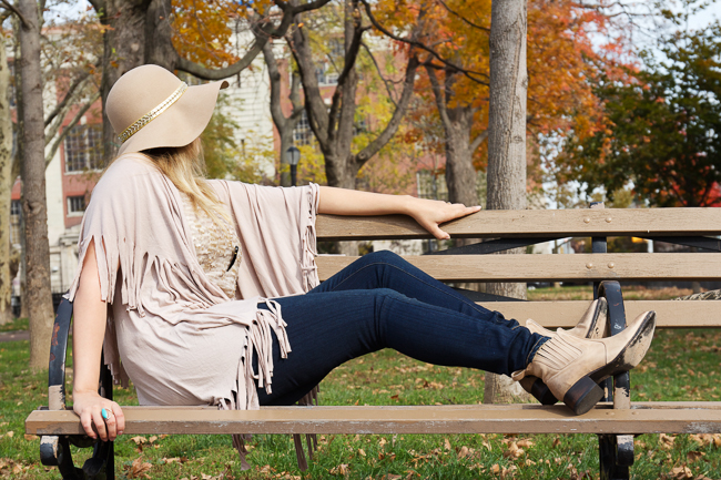 Freebird boots and Paige Denim paired with a floppy hat and neutral fringe poncho