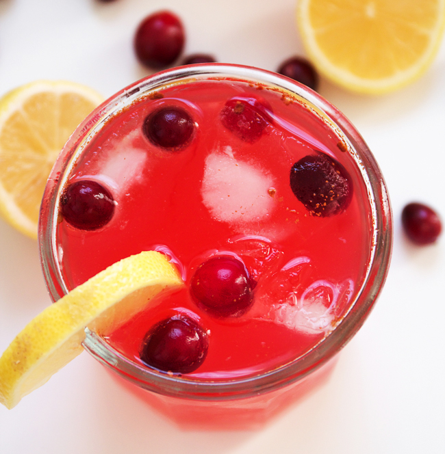Holiday Cranberry Lemonade with tart lemons, sweet cranberry simple syrup and a touch of cinnamon