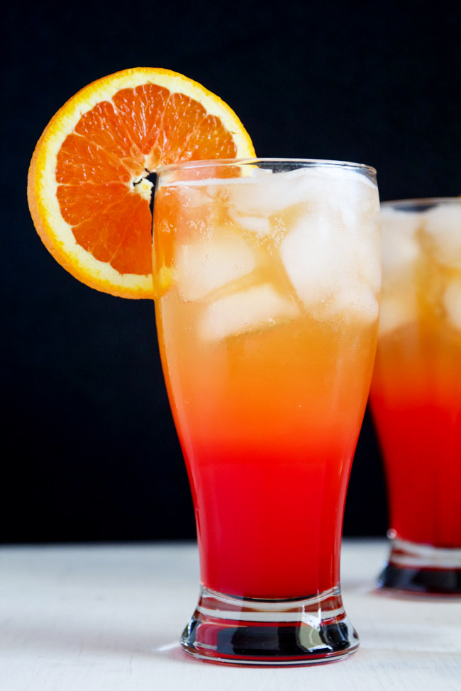 Corona Sunrise Cocktails with an Orange Wheel Garnish