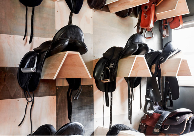 Clean english saddles in the tack room