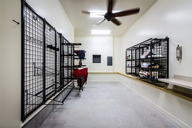 Clean and bright tack room with lots of space