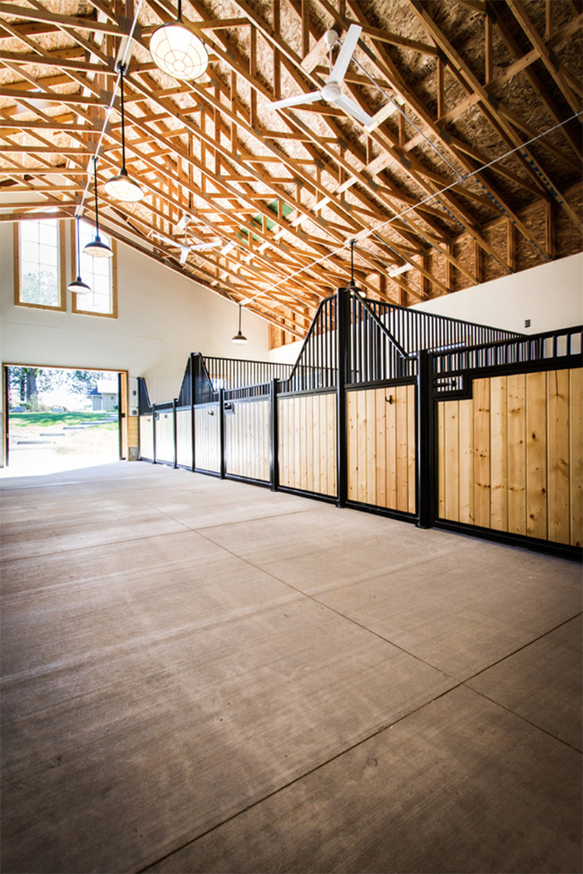 Interior of the horse barn has high ceilings