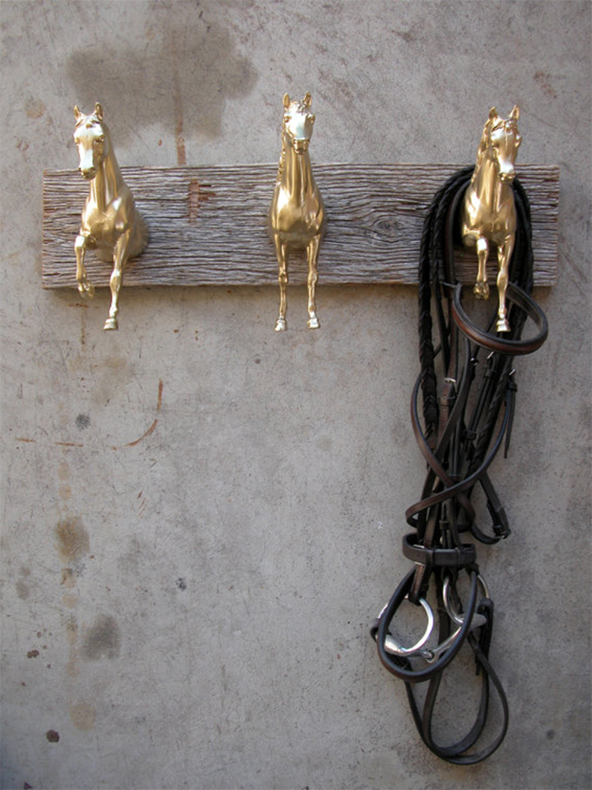 Gold Breyer horses on reclaimed wood