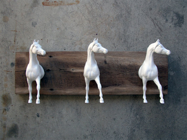 Three Arabian horse heads on reclaimed wood