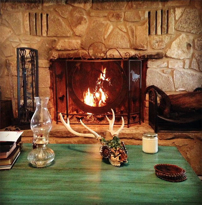 A cozy fireplace at The Sugar & Spice Ranch