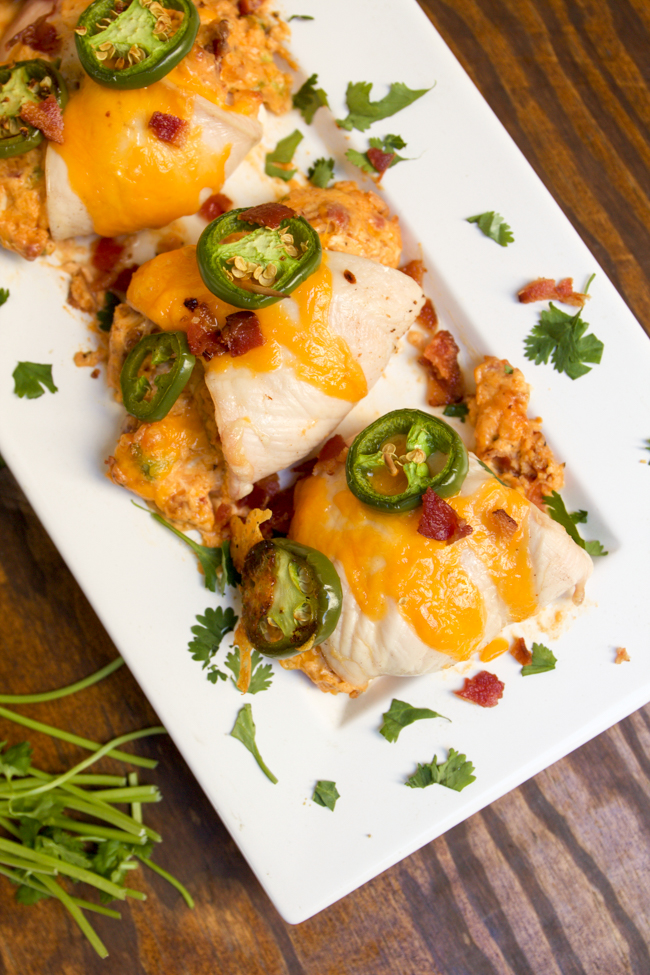 Juicy stuffed jalapeño chicken breasts with cream cheese, bacon, jalapeño, and cheddar