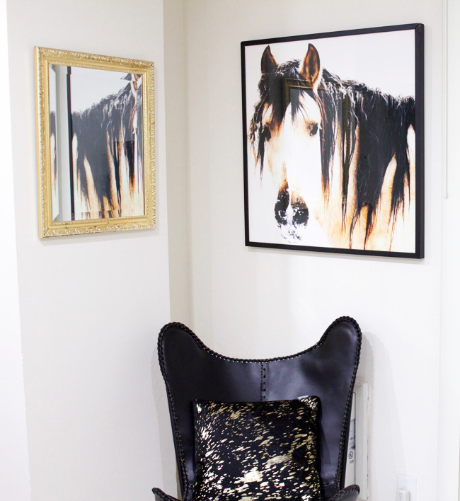 large horse head art plus leather butterfly chair in the corner