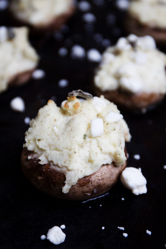 Potato and goat cheese stuffed mushrooms topped with sage