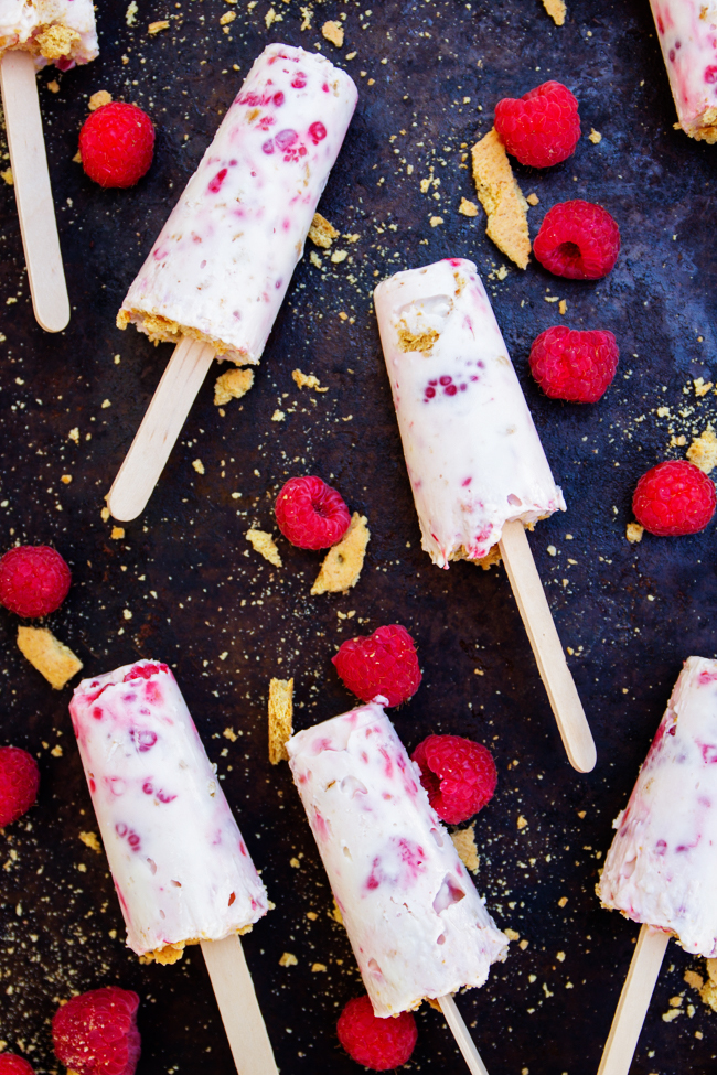Raspberry Cheesecake Popsicles with fresh berries