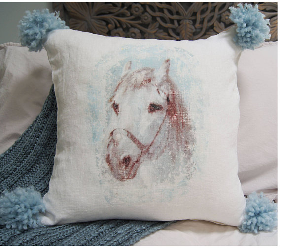 vintage horse pillow with pom poms