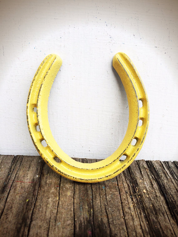 yellow horseshoe paper weight
