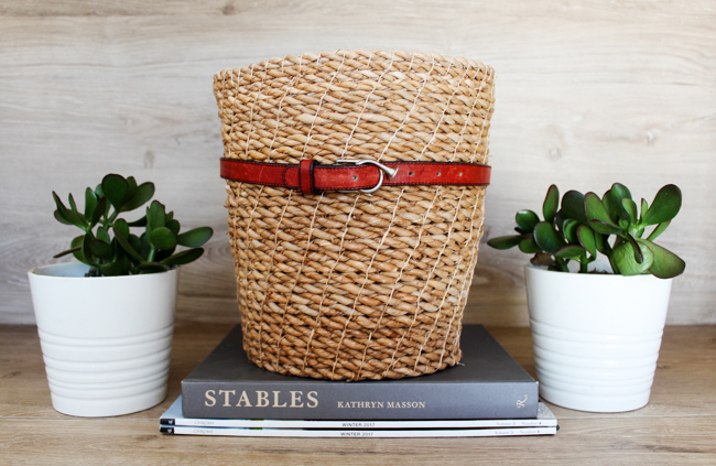 wrap an equestrian belt around a wicker basket to upgrade your wicker basket